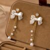 Elegant Bow and Pearl Drop Earrings - Image 3